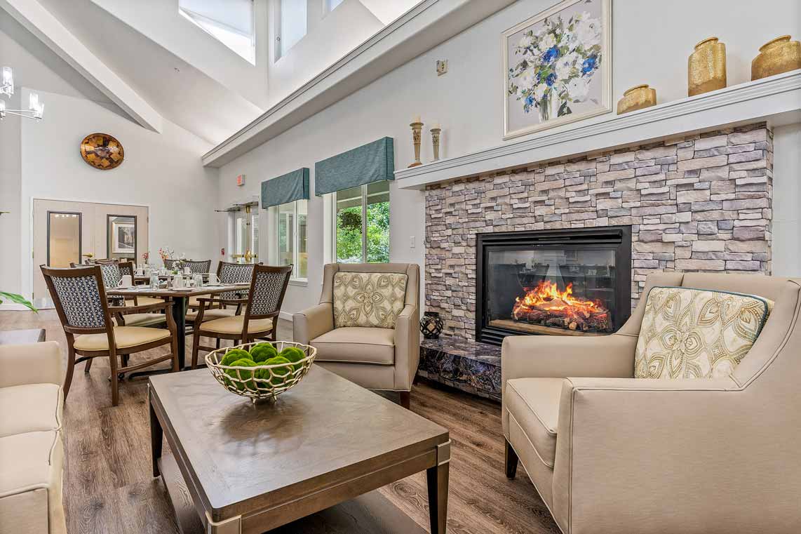 A cozy fireplace lounge at The Woods at Holly Tree
