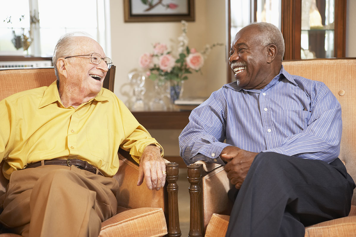 Residents laughing together at The Woods at Holly Tree